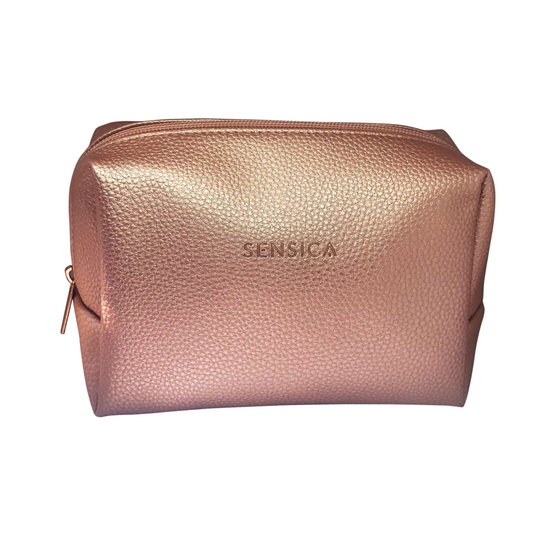 Rose gold cosmetic bag with 'Sensica' branding on a white background